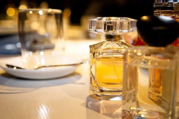 Perfumes on a table image on track orders page at Venus Scentuary website.